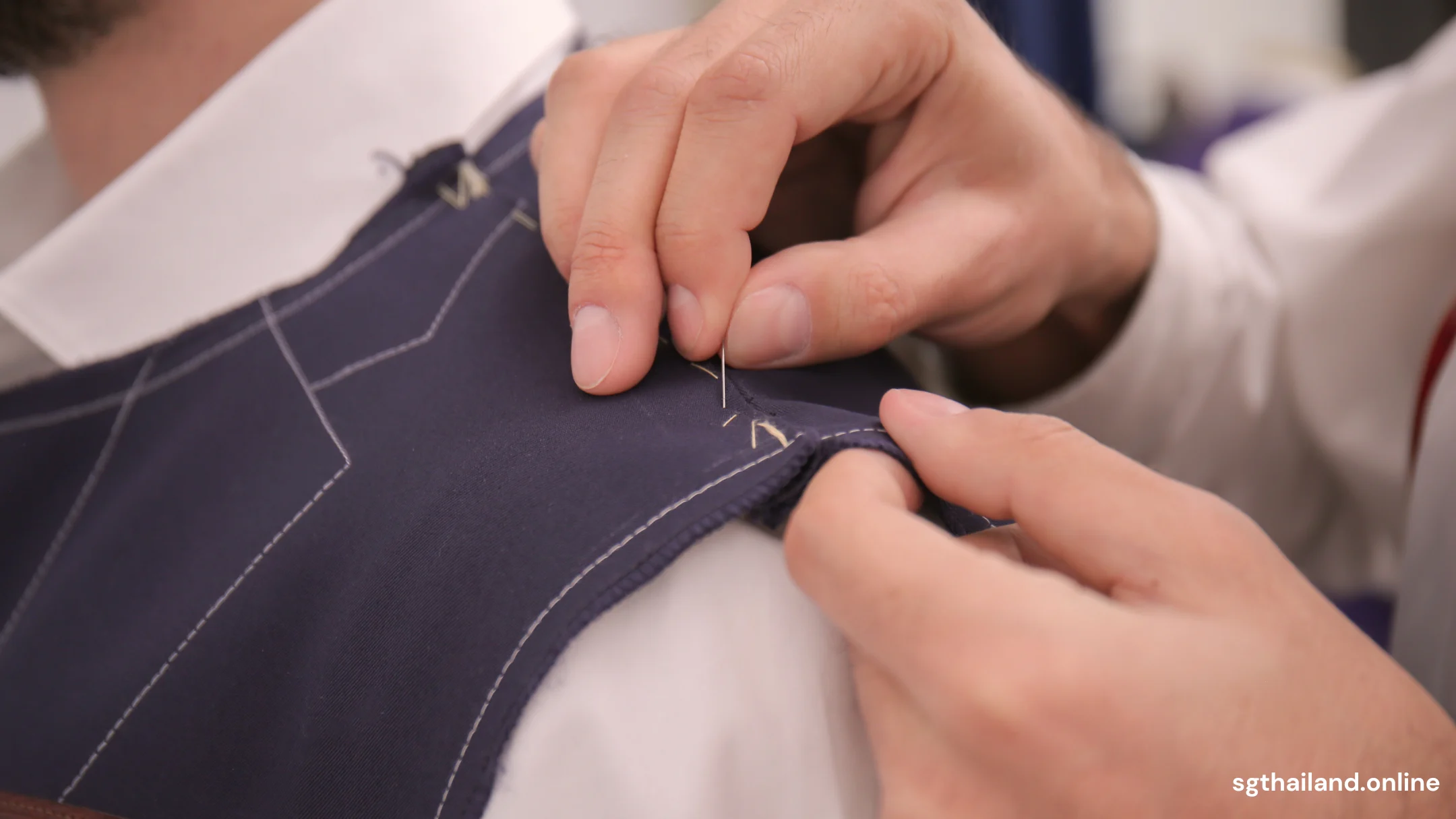 Tailor adjusting suit with pins - Bespoke tailoring Bangkok - SG Thailand